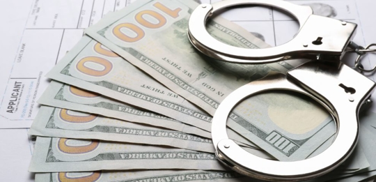 dollars and handcuffs